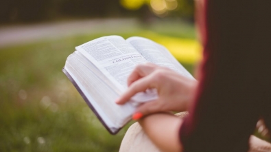 65016-woman-reading-bible-outdoors-unsplash-ben-whi.1200w.tn