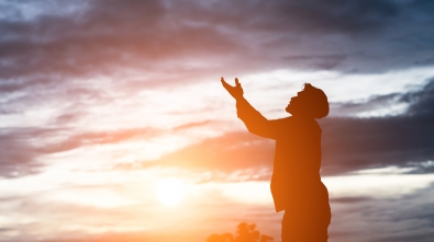 silhouette of handsome asian man praying.