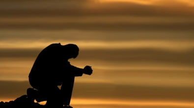 praying-and-kneeling-man