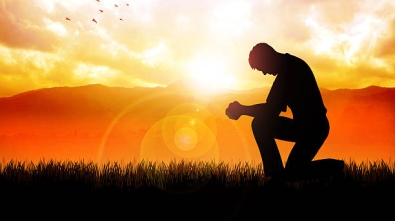 Silhouette illustration of a man praying outside at beautiful landscape