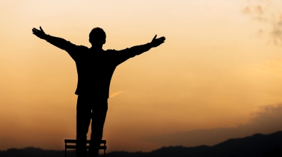 silhouette-of-a-man-standing-lift-hands-up-and-prayer-and-worship-god-at-sunset-concept-of-religion-free-photo
