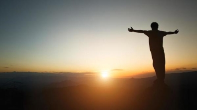 silhouette-of-man-rise-hand-up-praying-on-top-of-mountain-and-sunset-sky-abstract-background-freedom-and-travel-adventure-concept-free-photo
