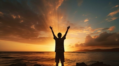 boy-s-silhouette-in-sunset-over-sea-representing-religion-worship-prayer-and-praise-free-photo