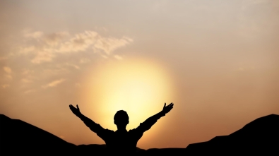 silhouette-of-a-man-lift-hands-up-and-worship-god-at-sunset-concept-of-religion-free-photo