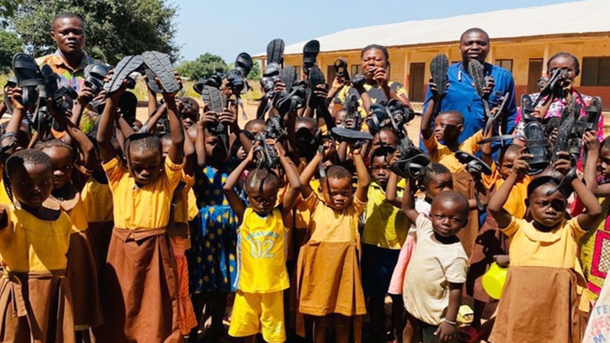 Babile District Donates 250 Pairs of Sandals to School Children in Wa Area web